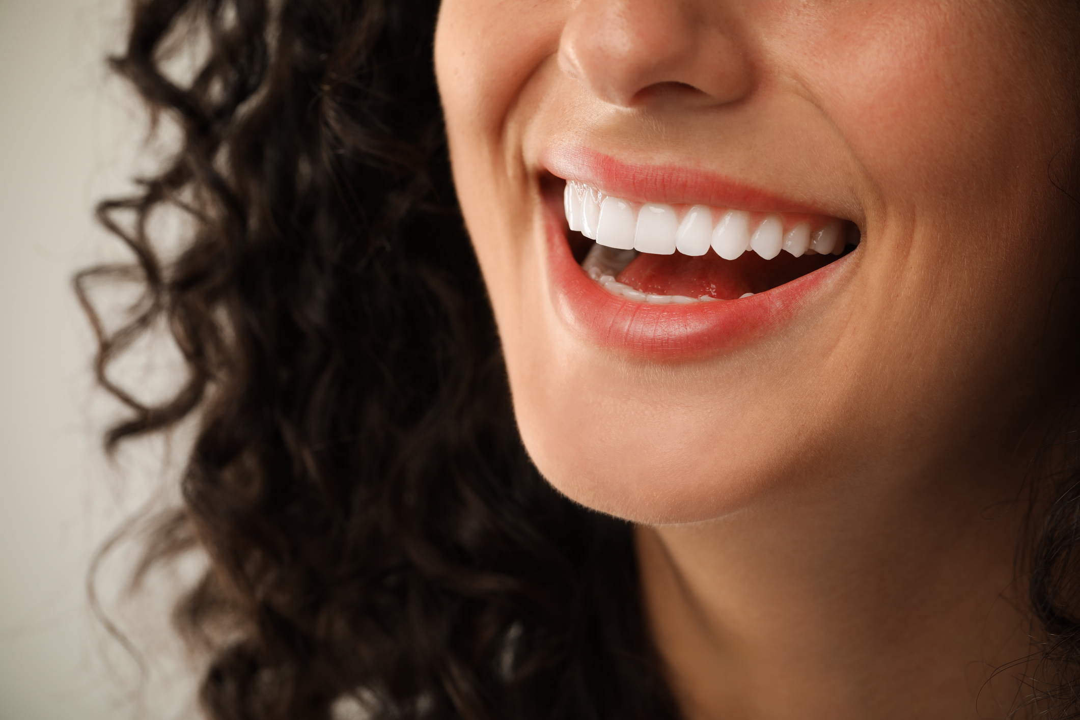Close-up of a patient smiling after cosmetic dentistry treatment.